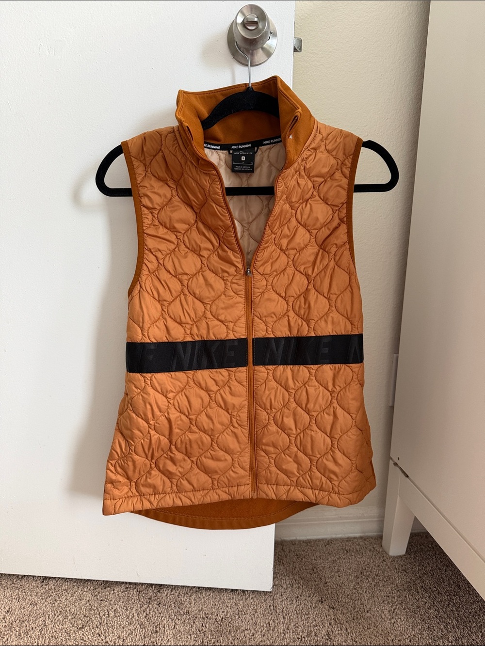 Nike Women's Orange Quilted Vest with Black Logo Band